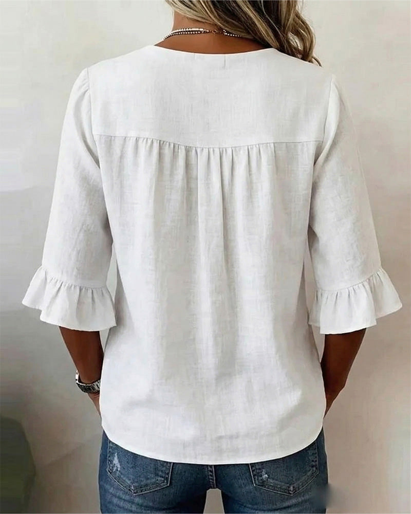 Laura | Blusa de lino con volantes y botones