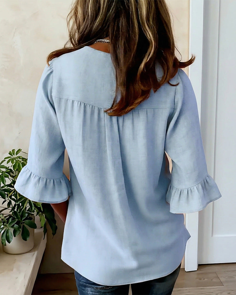 Laura | Blusa de lino con volantes y botones